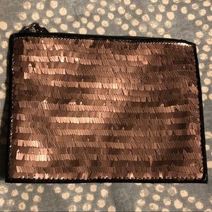 Brand new. Never used. Copper sequin pouch